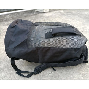 Oversized scuba diving backpack made from durable mesh tech fabric, holding mask, fins, and snorkel gear, designed for easy organization and quick drying.